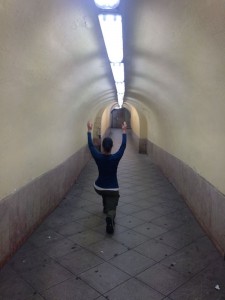At the train station. trying to keep warm. 