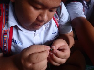 student making a bracelet