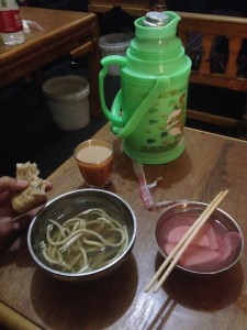 Breakfast. Butter tea and noodle soup. radish on the side. 
